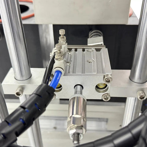 Close-up of Dual Head Automatic Vacuum Capping Machine For Glass Jars Bottle Sealer with control valves and tubing.