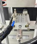 No Sweat Automatic Vacuum Bottle Capper With Responsive Foot Pedal And Smart Touchscreen close-up of pneumatic components.