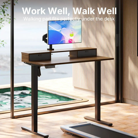 Spacious 40 X 24 Electric Standing Desk With Two Drawers And Hooks, Height Adjustable Computer Workstation C Clamp Mount Home Office Ergonomic Sit Stand Table Walnut with mounted monitor.
