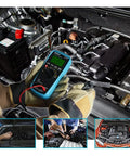 Mechanic using Automotive Dwell Meter Digital Multimeter Auto Range TRMS 5999 Counts Pro Grade on car engine