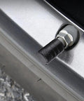 Heavy Duty 4 Pack Tire Valve Stem Caps For Tesla Cybertruck 2024 Through 2026 on a silver wheel valve close-up.