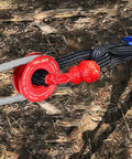 45000 Lbs Snatch Recovery Ring For Off Road Vehicles, red aluminum ring with rope and soft shackle in outdoor setting