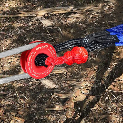 45000 Lbs Snatch Recovery Ring For Off Road Vehicles, red aluminum ring with rope and soft shackle in outdoor setting