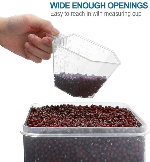 Hand using a measuring cup to scoop beans from Large Tall Airtight Food Storage Set, 10 Pack Plastic Canisters For Your Kitchen And Pantry Organization, With Labels, Ideal For Flour Sugar Rice And More Everyday.