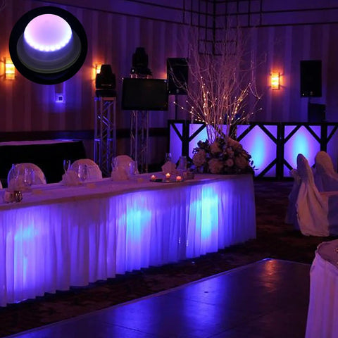 Wedding reception setup with glow from 4 Pack LED Under Table Lights For Parties, RGB Color Changing Uplighting at tables.