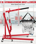 2 Ton Cherry Picker Engine Hoist Folds Flat To Save Bay Space Rolls Smooth On Six Heavy Duty Casters Includes Hand Pump For Garage Crew Auto Projects 4400 Lb with engine raised.