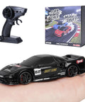 1 To 64 Scale Mini RC Drift Car With LED Lights on hand with remote control and box, Micro 4WD Desktop Remote Control, 2.4GHz
