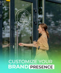 Woman entering office with custom business logo decal for walls and windows that helps you personalize your brand.