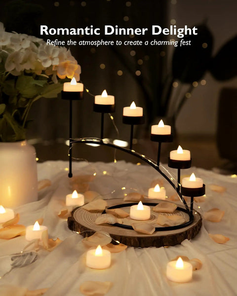 100 Pack Flameless LED Tea Light Candles Bulk With Long Lasting Battery For Safe Realistic Flicker Ambience At Weddings Parties And Home Decor Projects displayed on a decorative table with flowers and petals.