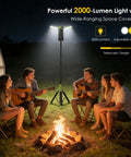 Group of campers around a fire using a Rechargeable Camping Lantern With 9000mAh Battery, Adjustable 270-Degree Horizontal Light