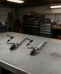 Two Pack Quick Action Bench Dog Clamps For 16mm Holes Hold Down Clips With Fast Lock 160mm Clamp Range Solid Metal in workshop.