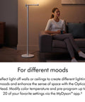 Solarcycle Morph Floor Light CF06 Smart Multi Mode Lamp next to a person on a sofa in a modern living room setting