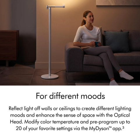 Solarcycle Morph Floor Light CF06 Smart Multi Mode Lamp next to a person on a sofa in a modern living room setting
