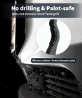 Close-up of Juniper 2026 Model Y License Plate Holder showing no-drill fit with silicone cushion protecting bumper paint.