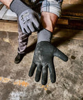 Person wearing Precision Nitrile Coated Work Gloves With Grippy Ultra Tough Grip For Wet, Dry, And Oily Conditions, gray medium.