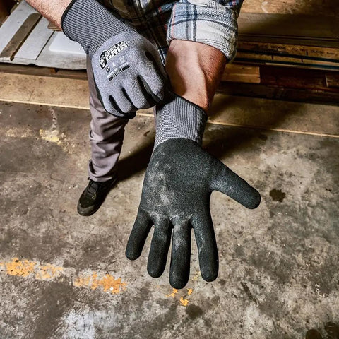 Person wearing Precision Nitrile Coated Work Gloves With Grippy Ultra Tough Grip For Wet, Dry, And Oily Conditions, gray medium.