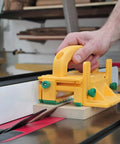 GRR-RIPPER 3D Pushblock With One Eighth Inch Leg For Table Saws in use on a table saw with wood piece cutting