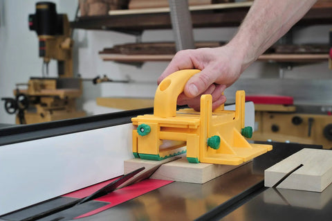 GRR-RIPPER 3D Pushblock With One Eighth Inch Leg For Table Saws in use on a table saw with wood piece cutting
