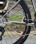 Back view of bike with high tensile steel wheel secured by Bike Wheel Nut And Safety Washer Kit, 24 pieces for mountain rides.