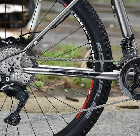 Back view of bike with high tensile steel wheel secured by Bike Wheel Nut And Safety Washer Kit, 24 pieces for mountain rides.