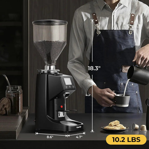 Straight Up Pro Level Electric Coffee Grinder With Industrial Flat Steel Burrs 19 Adjustable Grinding Settings Digital Timer Lock And Huge Thirty Five Ounce Hopper next to a barista pouring milk