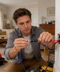 Man using Double Wire Plug In Connectors With Locking Buckle No Wire Stripping Required Quick Connect Two Pin Electrical Splice