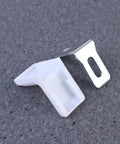 Close-up of a white plastic corner bracket from 28 Pack White Plastic Corner Brackets For Furniture Reinforcement Anti Slip Desk And Chair Corner Braces