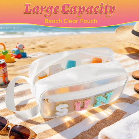 Clear SPF Sunscreen Bag With Handle For Beach And Pool on sandy beach, filled with toiletries, text 'SUN' on see-through side