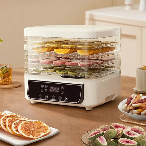 Top Shelf Five Tray Electric Food Dehydrator Featuring Killer 360 Airflow And Smart Controlled Digital Timer To Nail Fresh Fruit Veggies Meat And Healthy Homemade Snacks Daily with sliced fruits on trays.
