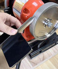 Heavy Duty Woodturning And Carving Tool Sharpening Jig For 6 Inch To 8 Inch Bench Grinders with precision steel arm in use.