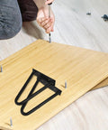 Installing Black Iron Hairpin Table Leg Set, 2 Pack, Heavy Duty Easy Install Metal Furniture Legs on wooden table top.