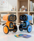 Saltwater Powered Robot Kit for STEM Learning No Batteries Needed DIY Science Toy Gift Kid Friendly Perfect for Festivals and Birthdays Awesome for Boys and Girls Blue Hands On Experiments Environmentally Friendly, showing two robots on a desk, one orange, one blue.