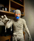 Mummy figure with glowing red eyes and blue mouth lit by 50 Pack Mini LED Lights Kit For Crafts And Dollhouses RGB Color Changing
