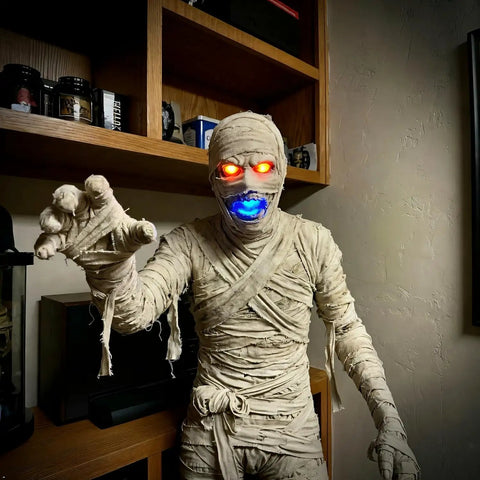 Mummy figure with glowing red eyes and blue mouth lit by 50 Pack Mini LED Lights Kit For Crafts And Dollhouses RGB Color Changing