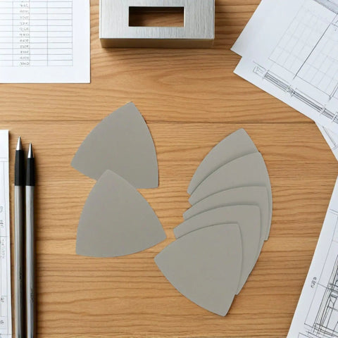 Top Rated Grit Triangular Silicon Carbide Sandpaper Sheets Waterproof Wet Dry Sanding Paper 8 Pack arranged on a wooden surface.