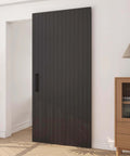 Concealed Sliding Barn Door With Soft Close Hardware Kit Black Hidden Door 40 by 86 inches in modern living room setting