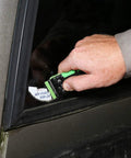 11 Piece Multi Purpose Razor Blade Scraper Kit With 10 Blades For Window Glass Sticker Removal being used on car window