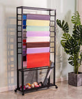 Heavy Duty Steel Mobile Cart And Fabric Roll Storage Rack For Textile Wallpaper Organizing With 200Kg Capacity And Slick Lockable Casters that displays vibrant fabric rolls.