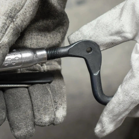 Close-up of Pro Grade Pipe Pliers With Large V Pads, 11 Inch, Adjustable Top Spindle For 1 1/2 To 2 1/2 Inch Pipes in use