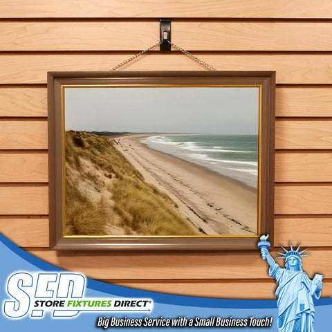 Notch Hook Picture Hanger for Slat Grid and Wall Panel Systems Black Finish holding a framed beach photo