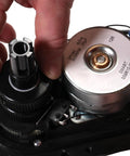 Intermatic PE24GVA 24V compact valve actuator, close-up of black housing, gear and metal motor can with wiring