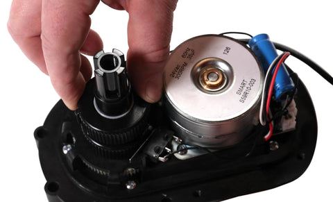 Intermatic PE24GVA 24V compact valve actuator, close-up of black housing, gear and metal motor can with wiring