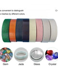 Colorful lapidary mesh rolls for gemstone cutting and polishing in green, orange, and other shades.