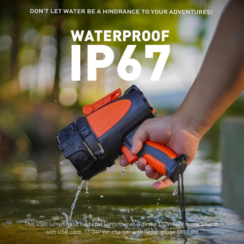Hand holding Rechargeable Handheld Spotlight With Up To 4500 Lumens, IP67 Waterproof Marine Grade LED Searchlight over water