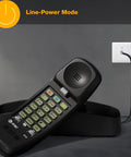 Straight Up Reliable Trimline Corded Landline Phone Works Like A Dream With Bright Backlit Keypad on a desk with the line connection.