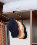 Absolute Knockout Tumbler Lid Organizer That Snaps Right Onto Standard Cups And Keeps Your Counter Dead Clean Without Any Hassle While Holding Ten Sip Lids In Chill Modern Black Design, showcasing hats hanging on black hooks.