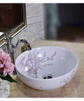 Top Shelf Above Counter Vessel Sink For Modern Bathroom Vanity High Gloss Art Porcelain Wash Basin Built Tough Ceramic Craftsmanship And No Sweat Install 40X15 Cm Slick Finish with floral design and chrome faucet.