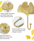 Ginkgo Leaf Wall Hooks Four Piece Iron Gold Key Holder And Hat Hanger featuring detailed ginkgo leaf design and smooth round hooks.