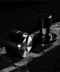 Straight Fire Dual Bearing Espresso Distributor And Tamper Combo Fits 51 54 58mm Filter Baskets Handheld coffee ground leveler tool close-up on black background.