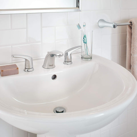 Colony Pro 8 Inch Widespread Two-Handle Low Arc Bathroom Faucet With Pop-Up Drain Assembly 1.2 GPM Polished Chrome on white sink